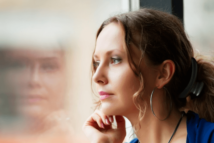 Woman gazing out window
